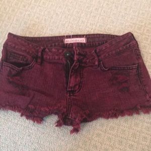 red acid washed jean shorts
